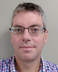 Dr Justin Travers
